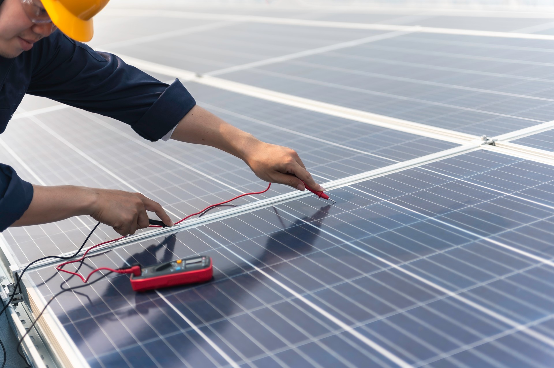 Engineer service check installation solar cell on the roof of factory on the morning. Silhouette technician inspection and repair solar cell on the roof of factory.